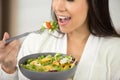 close up woman eating salad