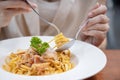 Close-up on Woman Eating Spaghetti with a Fork Royalty Free Stock Photo
