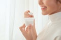 Close up woman eating yogurt behind the window Royalty Free Stock Photo