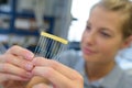 close up woman with electronics pieces in hand Royalty Free Stock Photo