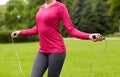 Close up of woman exercising with jump-rope Royalty Free Stock Photo