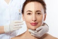 Close up woman face before after lifting injection. Middle age lady before-after wrinkled skin, eye bags, nasolabial folds. Face Royalty Free Stock Photo