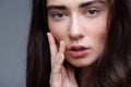 Close up woman face on light grey background