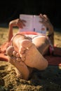 Close up of woman feet with sand at sunny beach Royalty Free Stock Photo