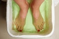 Woman feet in spa bowl