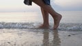 Close up woman feet walking barefoot on beach at sunset Royalty Free Stock Photo