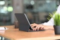 Close up of woman fingers typing a business document on the computer tablet at office. Royalty Free Stock Photo