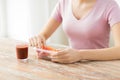 Close up of woman with food in plastic container Royalty Free Stock Photo