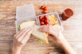 Close up of woman with food in plastic container Royalty Free Stock Photo