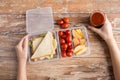 Close up of woman with food in plastic container Royalty Free Stock Photo