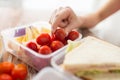 Close up of woman with food in plastic container Royalty Free Stock Photo