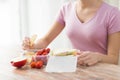 Close up of woman with food in plastic container Royalty Free Stock Photo