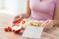 Close up of woman with food in plastic container Royalty Free Stock Photo