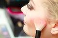 Close up woman getting make up, blush Royalty Free Stock Photo