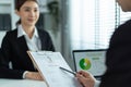 Close up of woman give resume to hr manager for job interview in office. Female sit on table and discuss with human resources Royalty Free Stock Photo