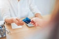 Close up of woman giving credit card payment from customer, shopping and technology concept. Royalty Free Stock Photo