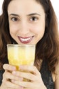 Close up of woman with a glass of banana smoothie