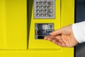 Close up of woman hand with credit card withdrawing money at ATM Royalty Free Stock Photo