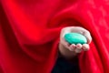 Close up of woman hand hold green soap for cleaning wih red towel,Soap for cleaning for good health Royalty Free Stock Photo