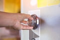 Close up of a woman hand hold and tuning on a combinations safe dial lock