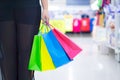 Close up woman hand holding many shopping bags in the shopping mall. Shopping concept Royalty Free Stock Photo