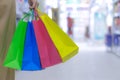 Close up woman hand holding many shopping bags in the shopping mall. Shopping concept Royalty Free Stock Photo