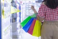 Close up woman hand holding many shopping bags in the shopping mall. Shopping concept Royalty Free Stock Photo