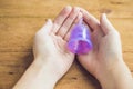 Close up of woman hand holding menstrual cup Royalty Free Stock Photo