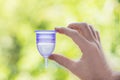 Close up of woman hand holding menstrual cup Royalty Free Stock Photo