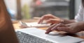 Close up of woman hand holding pencil working on calculator to calculate financial data report, accountancy document and laptop Royalty Free Stock Photo