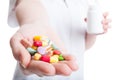 Close up with woman hand holding pills Royalty Free Stock Photo