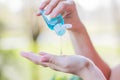 Close Up of Woman Hand Holding Sanitizer Alcohol Gel Dispenser Against 2019-nCoV Royalty Free Stock Photo