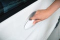 Close up woman hand opening a car door Royalty Free Stock Photo