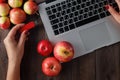 Close up of a woman hand plugging red pendrive on a laptop Royalty Free Stock Photo