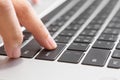 Close up of Woman hand pressing Enter button on laptop Royalty Free Stock Photo