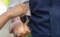 Close up of the woman hand is sending the car keys to the car mechanic. The concept of trust And confidence in using the service