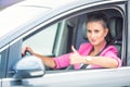 Close-up of a woman hand showing a thumbs-up sign out with car windows Royalty Free Stock Photo