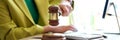 Woman hand striking with judge gavel in court room Royalty Free Stock Photo