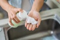 Close up of woman hand take cleaner foam from pump