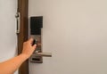 Woman hand twist door lock in hotel for safety