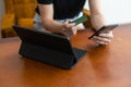 Close up of Woman hand using computer tablet blank white screen and holding credit card shopping online or internet Royalty Free Stock Photo