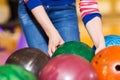Close up of woman hands choosing bowling ball Royalty Free Stock Photo