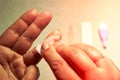 Close up of woman hands, cleaning the finger with an alcohol pad for express HIV test Royalty Free Stock Photo