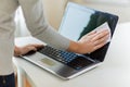 Close up of woman hands cleaning laptop screen