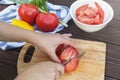 Close Up of woman hands cooking vegetable salad in kitchen on the wooden table. Healthy meal, and vegetarian food Royalty Free Stock Photo