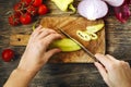 Close-up of woman hands cutting vegetables on the board. Royalty Free Stock Photo