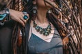 Close up of woman hands with with gem stones accessories outdoors