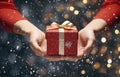 Close up of woman hands holding christmas gift box on bokeh background Royalty Free Stock Photo