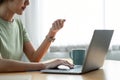 Close up woman hands holding a credit card and using computer keyboard for online shopping at home. Royalty Free Stock Photo