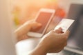 Close up woman hands holding credit card and using a smartphone for shopping purchasing online. Mobile payments, e-commerce Royalty Free Stock Photo